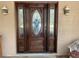 Elegant double wooden front door with beveled glass at 2436 Cr 416N, Lake Panasoffkee, FL 33538