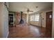 Living room featuring a brick fireplace, wood floors, and a view of the backyard at 9701 E Warm Springs Ave, Coleman, FL 33521