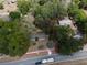 Aerial view of a single-story house on a tree-lined street at 9701 E Warm Springs Ave, Coleman, FL 33521