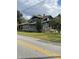 Two-story home with shingle siding and mature landscaping at 5708 Se 109Th St, Belleview, FL 34420
