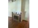 Classic brick fireplace with gold accents in living room at 5708 Se 109Th St, Belleview, FL 34420
