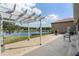 Large patio with pergola, fire pit, and lake view at 10120 Lakeshore Dr, Clermont, FL 34711