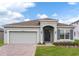 Two-story house with gray siding and a dark gray door at 429 Silver Palm Dr, Haines City, FL 33844