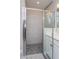 Walk-in shower with glass enclosure and pebble floor at 437 Silver Palm Dr, Haines City, FL 33844