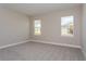 Spacious bedroom with neutral wall colors and carpet flooring at 437 Silver Palm Dr, Haines City, FL 33844