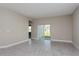 Living room with sliding glass doors leading to the backyard at 437 Silver Palm Dr, Haines City, FL 33844