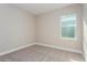 Well-lit bedroom featuring carpet flooring and a window at 437 Silver Palm Dr, Haines City, FL 33844