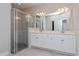 Bathroom boasts double vanity and a walk-in shower at 437 Silver Palm Dr, Haines City, FL 33844