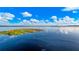 Stunning view of a tranquil lake under a bright sky at 1241 W Lakeshore Dr, Clermont, FL 34711