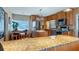 Bright kitchen with an island, granite countertops, and stainless steel appliances at 1241 W Lakeshore Dr, Clermont, FL 34711