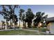 Sunset view of backyard with trees and lake access at 1241 W Lakeshore Dr, Clermont, FL 34711
