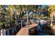 Wooden dock extending over calm lake waters, offering serene views at 1241 W Lakeshore Dr, Clermont, FL 34711