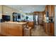 Kitchen features wood cabinets, granite counters, and stainless steel appliances at 1241 W Lakeshore Dr, Clermont, FL 34711