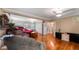 Main bedroom showcasing hardwood floors and access to bathroom at 1241 W Lakeshore Dr, Clermont, FL 34711
