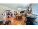 Spacious game room with a pool table and hardwood floors at 1241 W Lakeshore Dr, Clermont, FL 34711