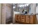 Updated bathroom with double vanity, large shower, and granite countertops at 1241 W Lakeshore Dr, Clermont, FL 34711