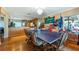 Dining room features a ping pong table and overlooks the waterfront at 1241 W Lakeshore Dr, Clermont, FL 34711