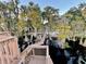 Wooden dock extending over calm lake waters, offering serene views at 1241 W Lakeshore Dr, Clermont, FL 34711