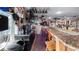 Well-equipped home bar with granite countertop and ample seating at 1241 W Lakeshore Dr, Clermont, FL 34711