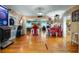Game room with dartboard, bar area and hardwood floors at 1241 W Lakeshore Dr, Clermont, FL 34711
