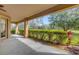 Covered patio overlooking a lush green landscape at 5418 Meadow Hill Loop, Lady Lake, FL 32159