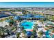Large community pool with surrounding lounge chairs at 2226 Lelani Cir, Davenport, FL 33897