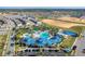 Blue-roofed clubhouse next to a large community pool at 2226 Lelani Cir, Davenport, FL 33897