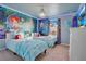 The Little Mermaid themed bedroom with twin beds and mural at 2226 Lelani Cir, Davenport, FL 33897
