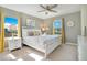 Bedroom with king-size bed, window, and ceiling fan at 2226 Lelani Cir, Davenport, FL 33897
