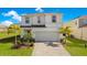 Two-story house with a two-car garage at 2226 Lelani Cir, Davenport, FL 33897