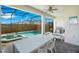 Screened pool and spa with patio furniture and grill at 2226 Lelani Cir, Davenport, FL 33897