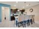 Kitchen island with granite countertop and seating for four at 2226 Lelani Cir, Davenport, FL 33897
