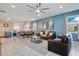 Open concept living and dining area with blue accent wall at 2226 Lelani Cir, Davenport, FL 33897
