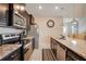 Modern kitchen with granite countertops and stainless steel appliances at 2226 Lelani Cir, Davenport, FL 33897