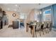 Bright dining room adjacent to kitchen, seating for six at 2226 Lelani Cir, Davenport, FL 33897