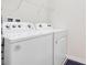 Bright laundry room with a Whirlpool washer and dryer at 2226 Lelani Cir, Davenport, FL 33897