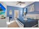 Spacious main bedroom with a large TV and ensuite bathroom at 2226 Lelani Cir, Davenport, FL 33897