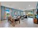 Open living room and dining area with tile floors and modern furnishings at 2226 Lelani Cir, Davenport, FL 33897