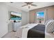 King-size bed, large TV, and window with a view at 2226 Lelani Cir, Davenport, FL 33897