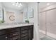 Double vanity bathroom with granite countertop and large mirror at 2226 Lelani Cir, Davenport, FL 33897