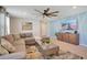 Relaxing living room with sectional sofa, coffee table, and wall-mounted TV at 2226 Lelani Cir, Davenport, FL 33897