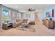 Bright living room featuring a comfortable sectional sofa and large TV at 2226 Lelani Cir, Davenport, FL 33897