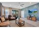 Living room with a fireplace and view of backyard pool at 2226 Lelani Cir, Davenport, FL 33897