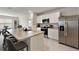 Sleek kitchen boasting stainless steel appliances and an island at 2720 Dumont Ln, Tavares, FL 32778