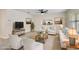 Virtually staged living room, featuring comfy seating and warm decor at 2720 Dumont Ln, Tavares, FL 32778