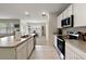 Open concept kitchen with ample counter space and cabinets at 2720 Dumont Ln, Tavares, FL 32778