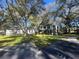 White building exterior with green roof and landscaping at 7874 Midway Drive Ter # V101, Ocala, FL 34472