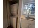 Stackable washer and dryer in a closet with window at 7874 Midway Drive Ter # V101, Ocala, FL 34472