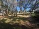 Mature trees and a grassy backyard with ample sunlight at 7874 Midway Drive Ter # V101, Ocala, FL 34472