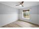 Spacious bedroom with large window and neutral walls at 21342 S Buckhill Rd, Clermont, FL 34715